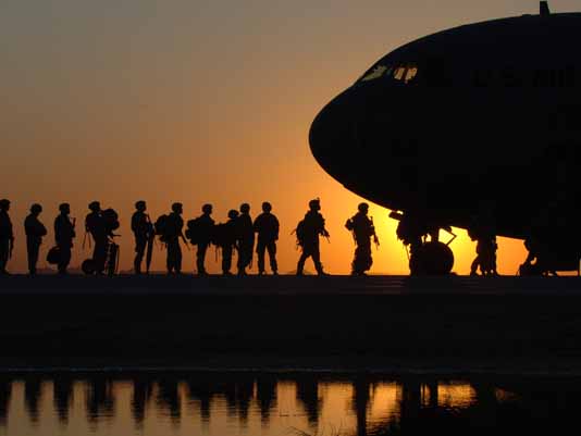 Soldiers boarding a C130